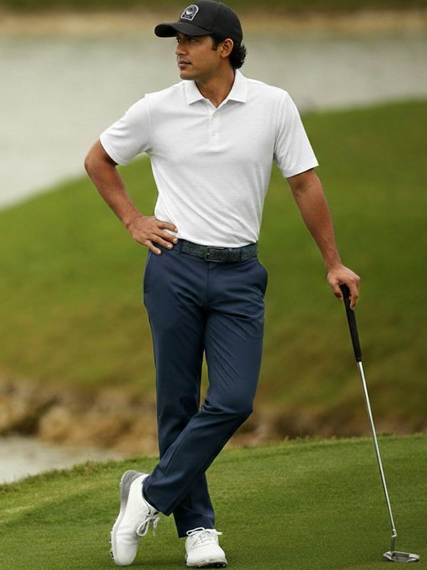 Male Model Wearing Ben Hogan White Polo with Navy Pants and Blue Cap